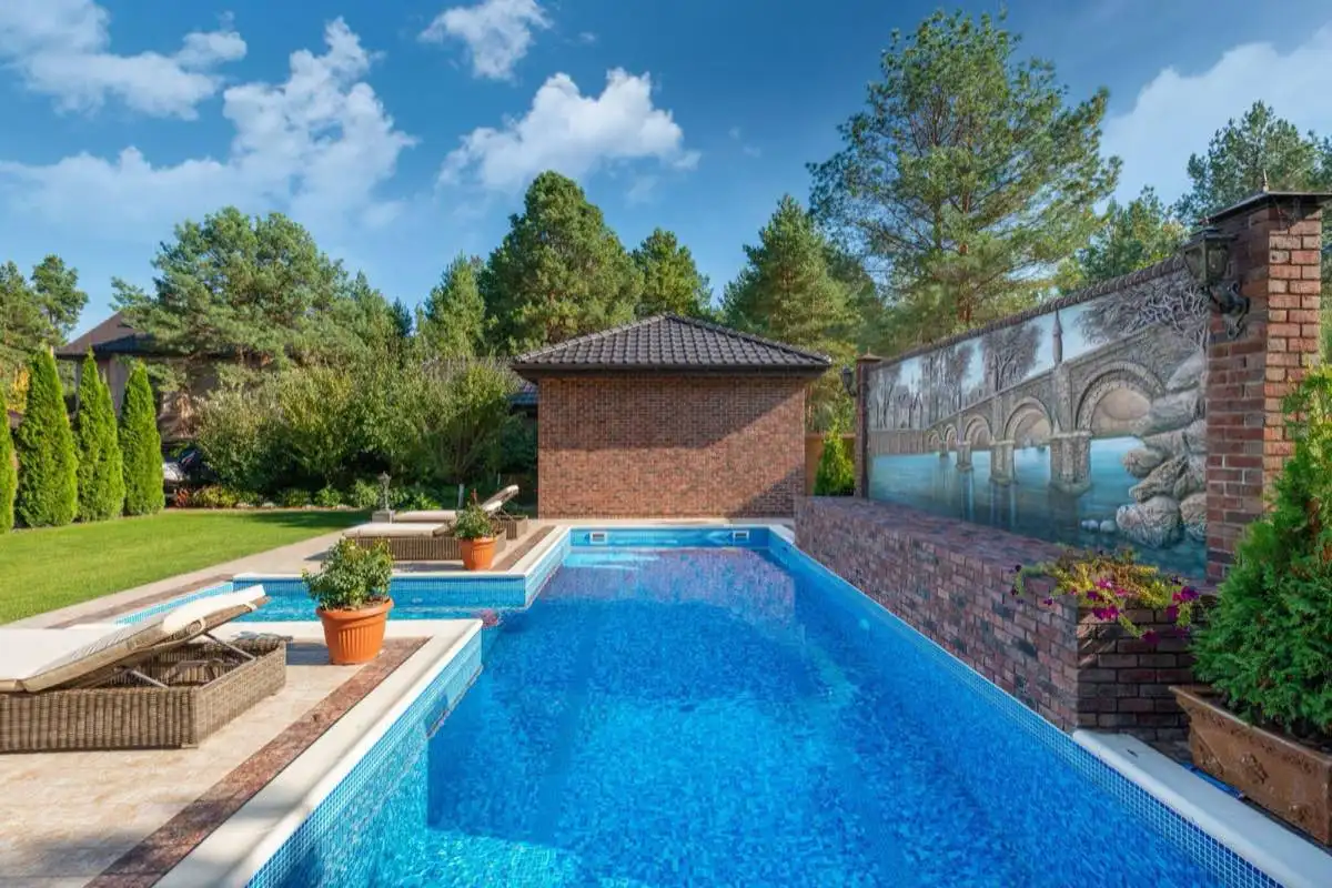 Backyard saltwater swimming pool in Elk Grove, CA on a clear day